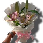 Premium fresh pink lily and  baby breath reels post  hand bouquet